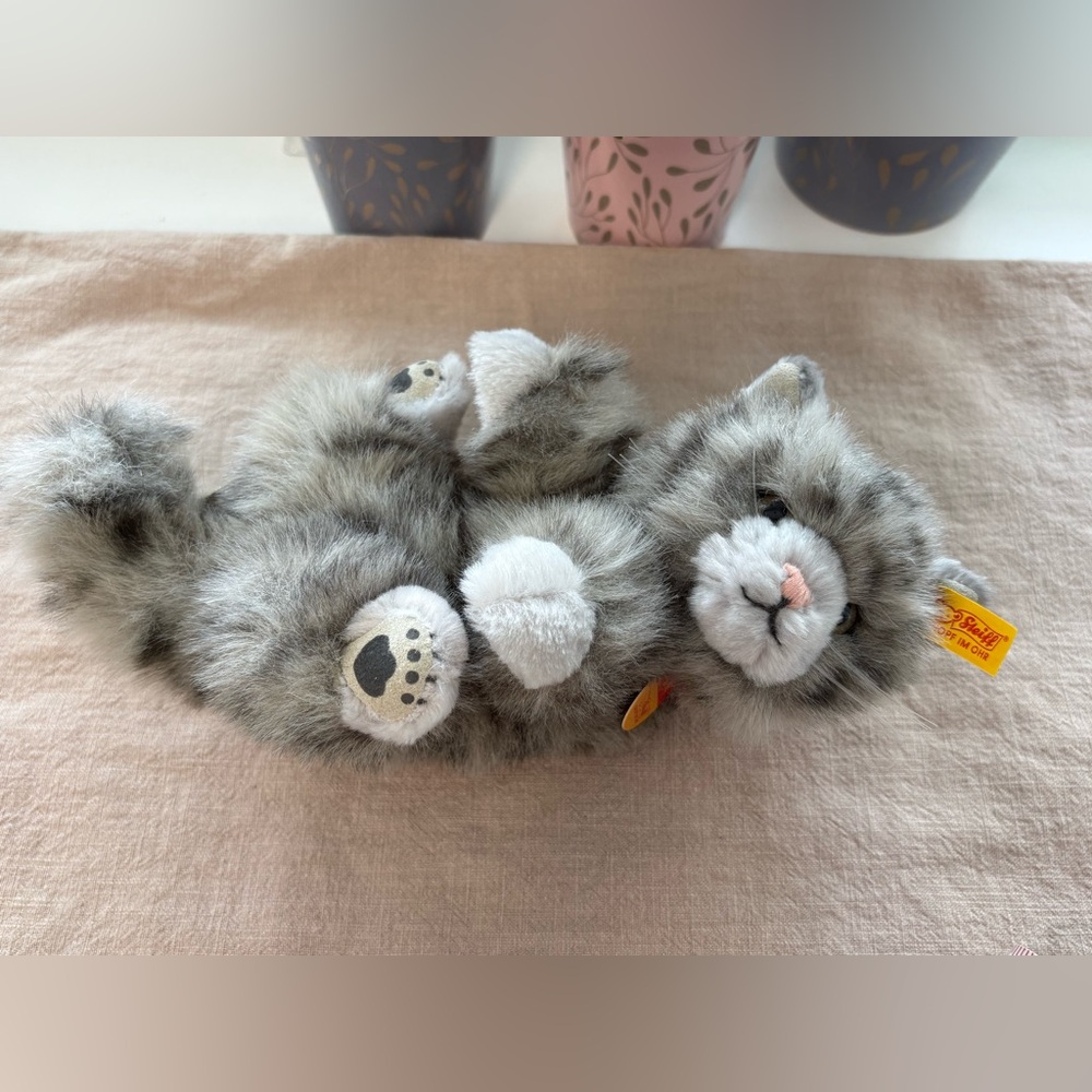 Plush Steiff kitten, laying on back, 10”